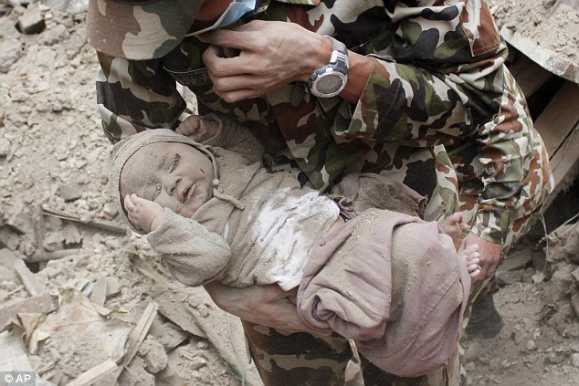 Nepali Army rescuing Anish who was buried in the earthquake rubble. Photo: AP